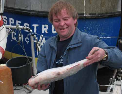 Eoin holding Monday's dinner - a red salmon